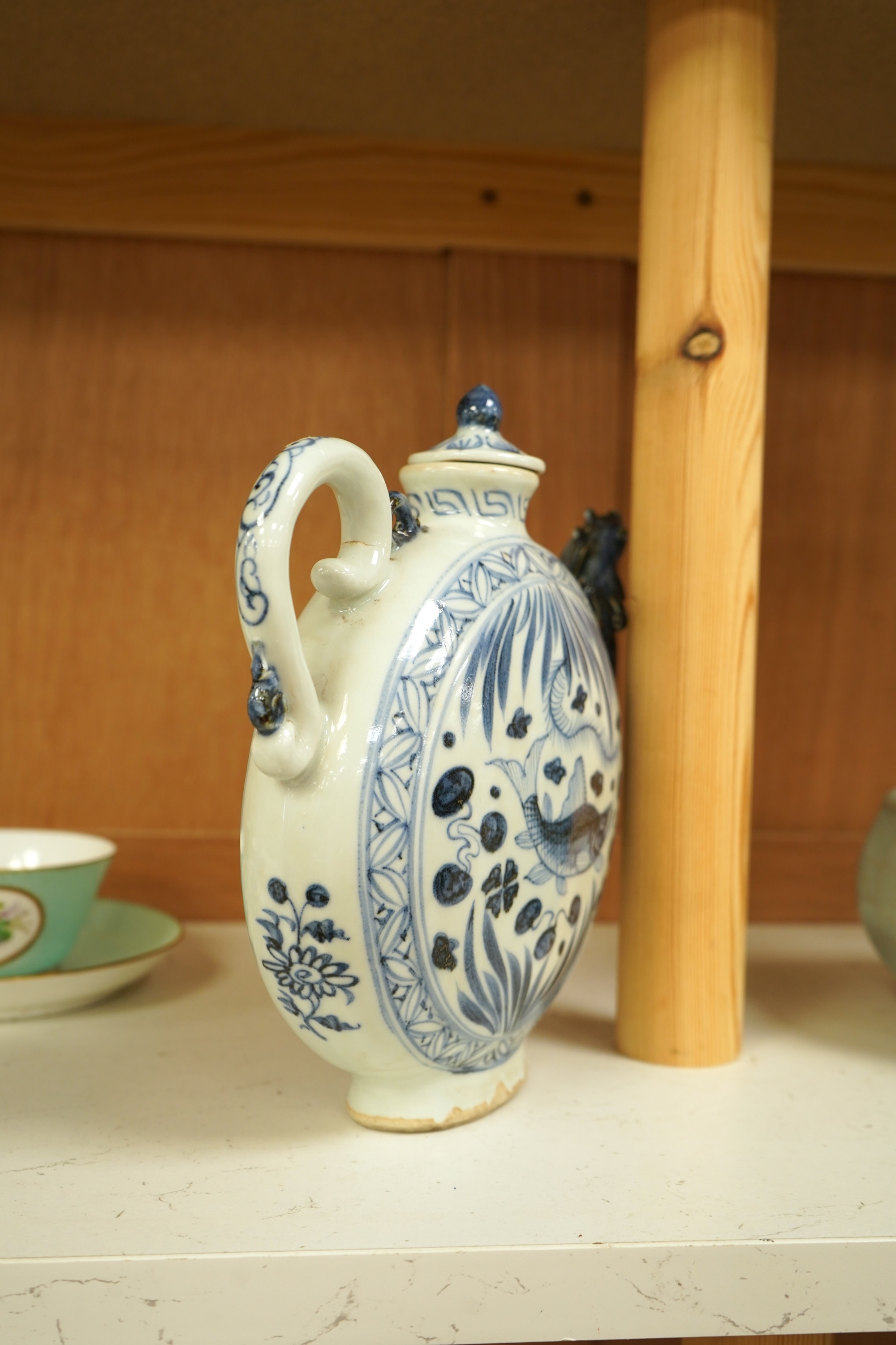 A Chinese blue and white moon flask wine pot with phoenix spout, 21cm high